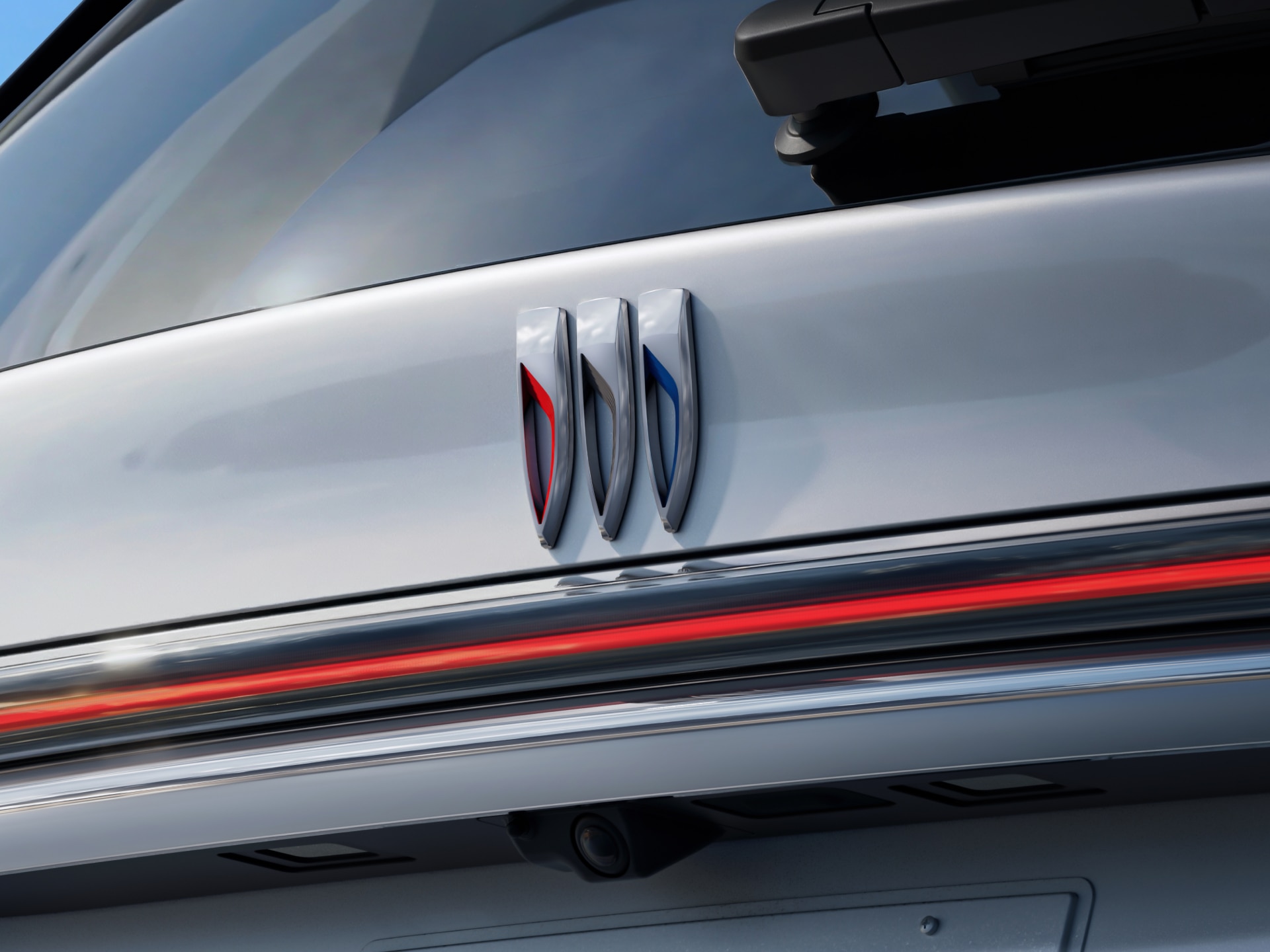 A Close-up of the Buick Tri-Shield Logo on the White Tailgate of a Buick Enclave