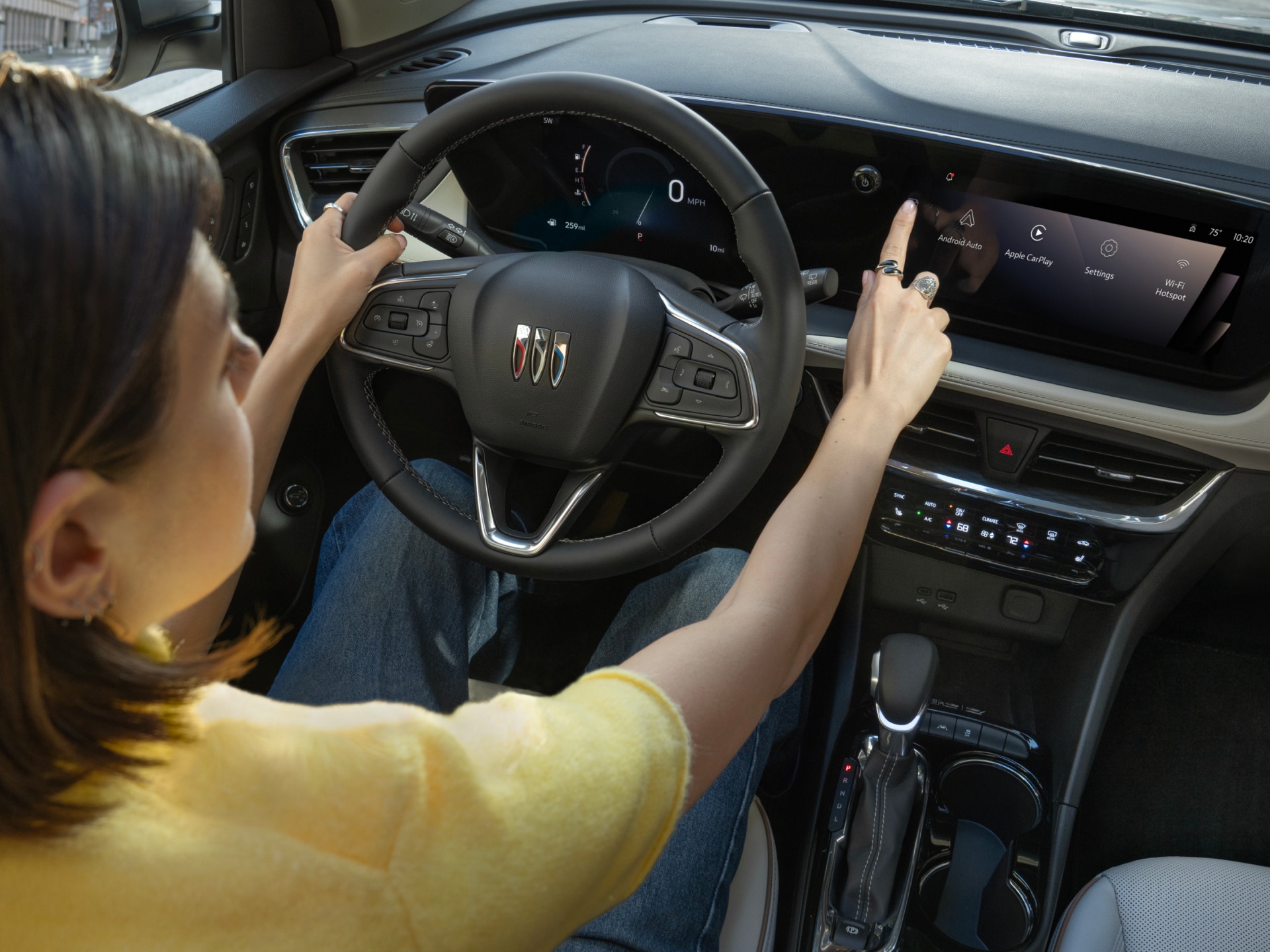 The Interior of a Buick Envision, Focusing on the Steering Wheel, Digital Dashboard, and Infotainment Screen