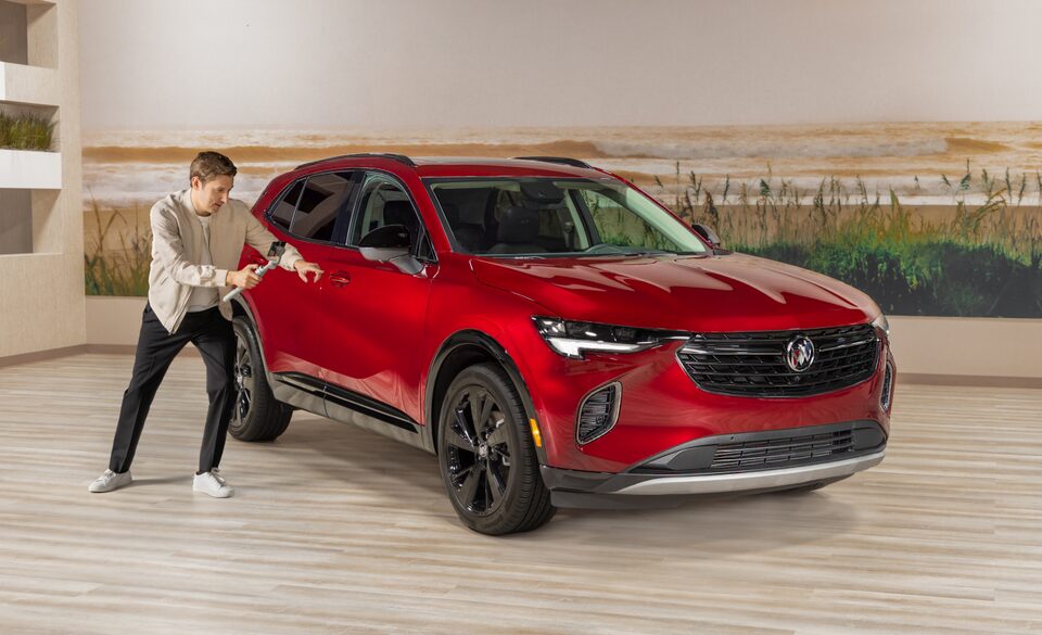 Women in Red Dress Walking Past a Summit White Buick