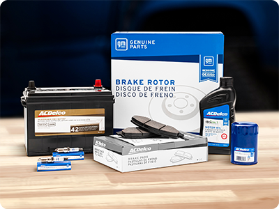 A Collection of ACDelco and GM Parts replacement parts on a Wood Table