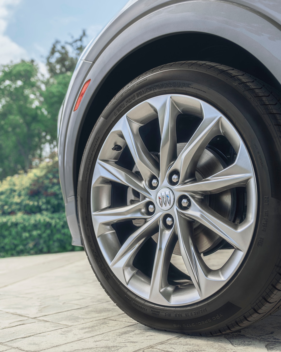 A Close-Up of a Tire on a Grey Buick Vehicle