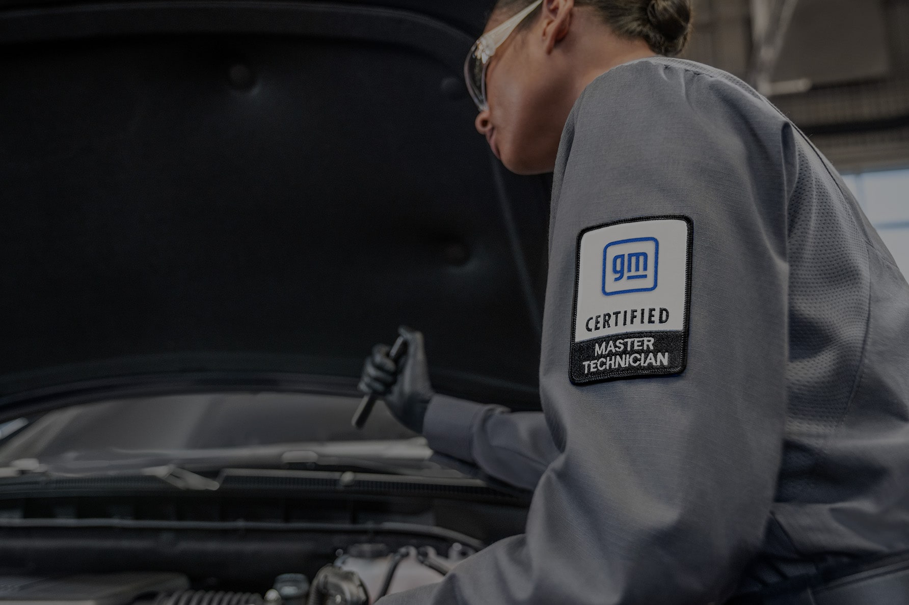 A Service Technician Inspecting a Vehicle with a Flashlight