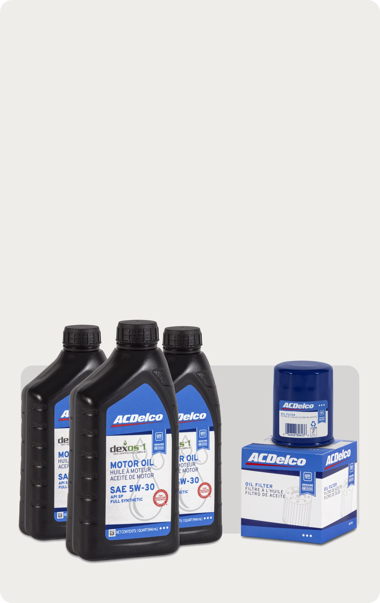 Three Bottles of ACDelco Oil and Accessories Against a White Background