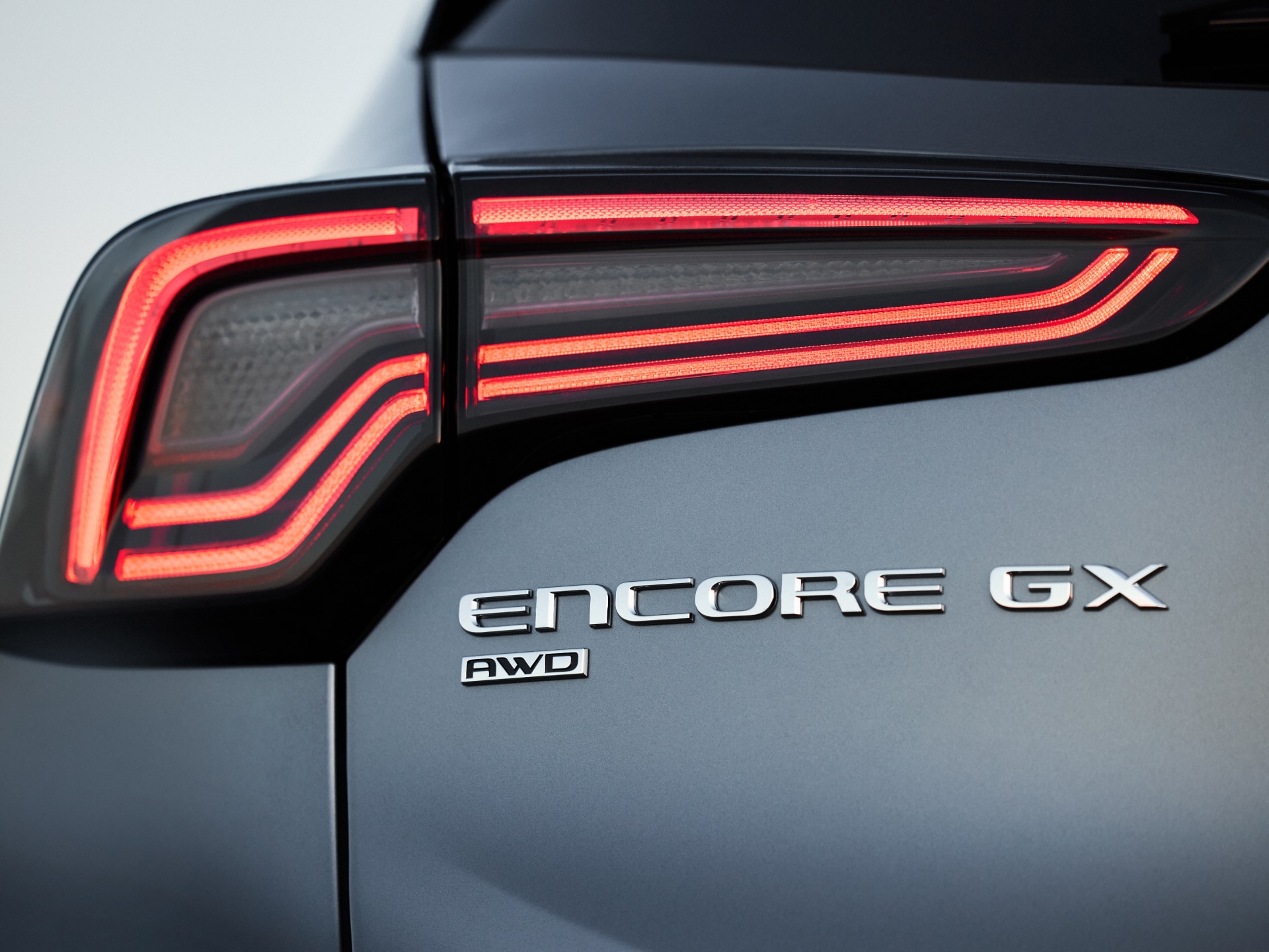 Close-up View of the Rear Headlight and Encore GX Badging