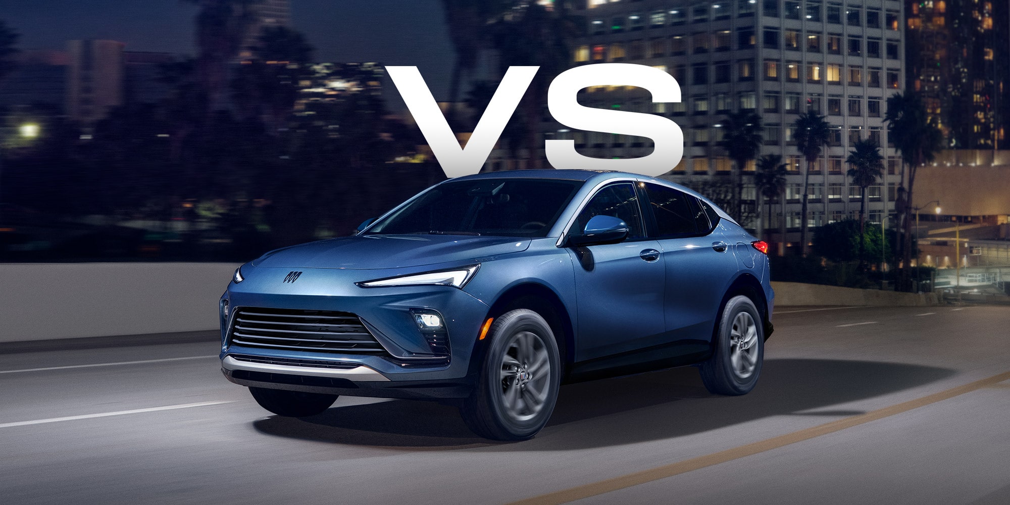 Front Three-quarters View of a White Buick Enclave Parked on a Beach as Waves Crash on the Shoreline