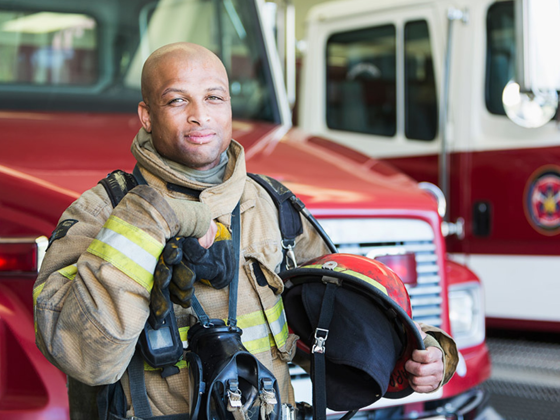 Fireman standing in front of Fire Engine