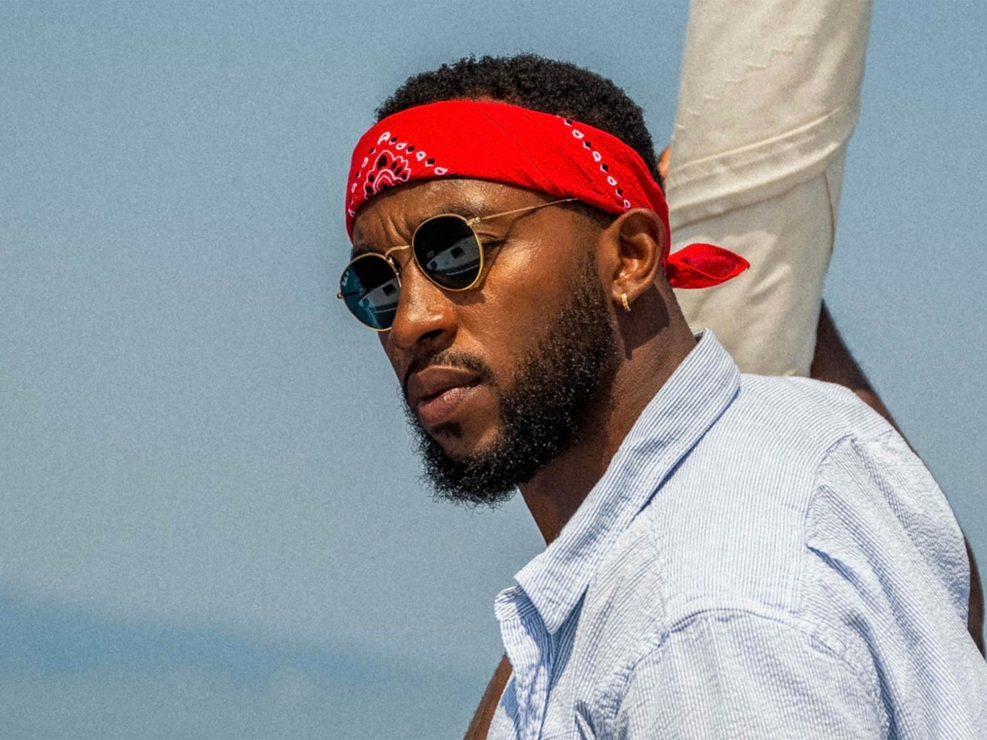 Rick Southers Wearing a Red Bandana And Sunglasses Looking To The Side