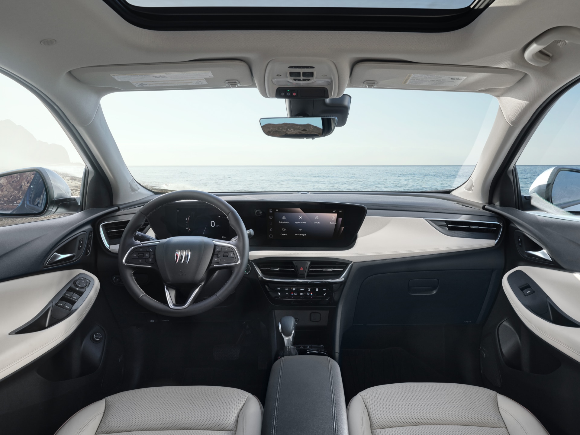 The interior of a Buick 2026 Encore GX with the ocean visible through the windshield.
