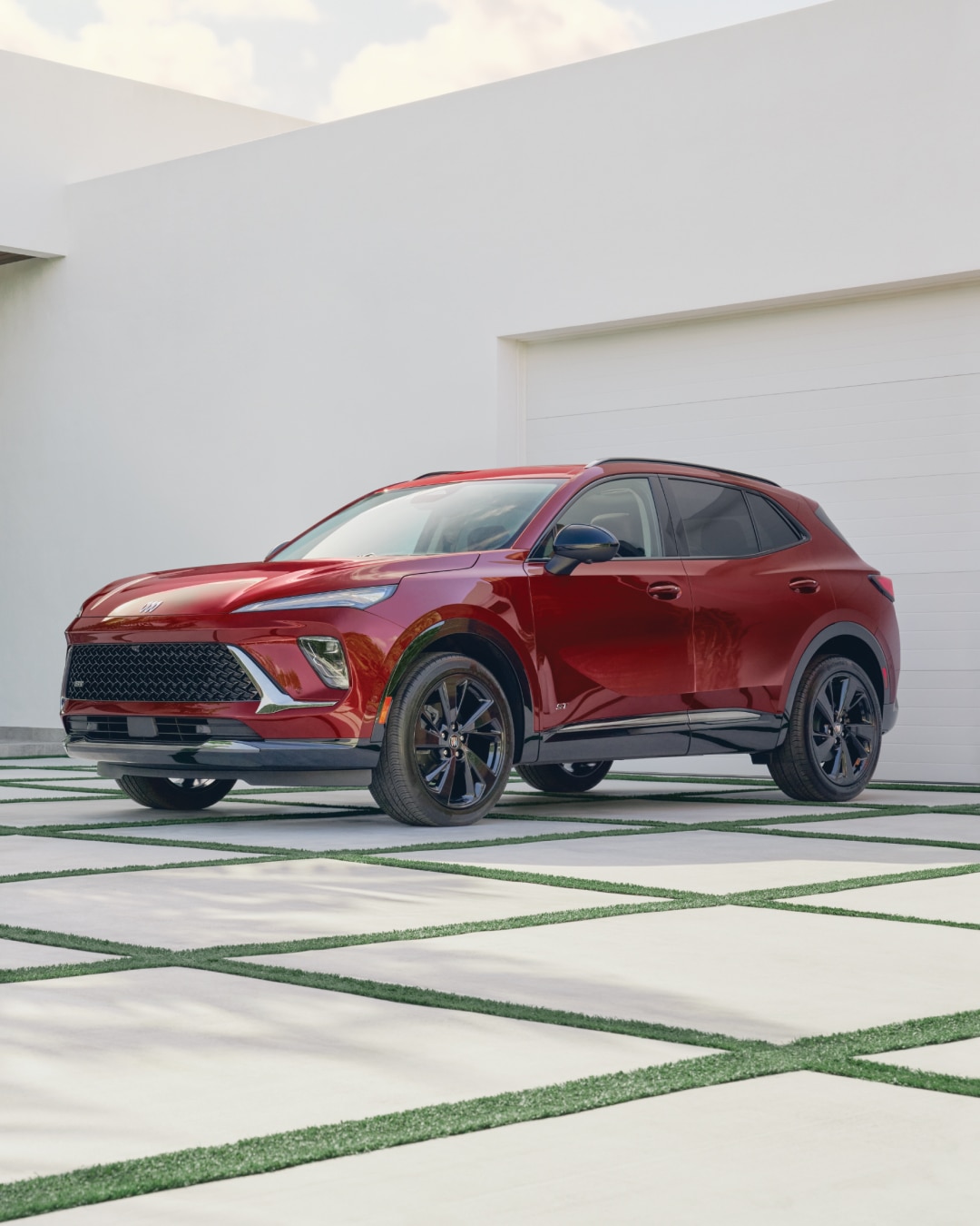 Wide Front Three-Quarters View of a Red Buick Envision Compact SUV