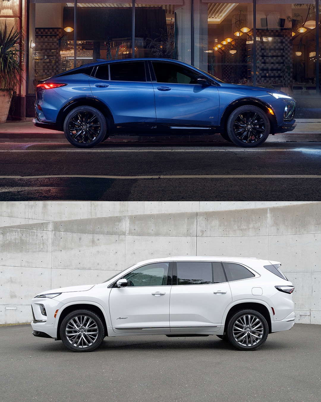 A blue Buick Envista SUV parked on a city street at night alongside a white Buick Enclave SUV next to a concrete wall. 