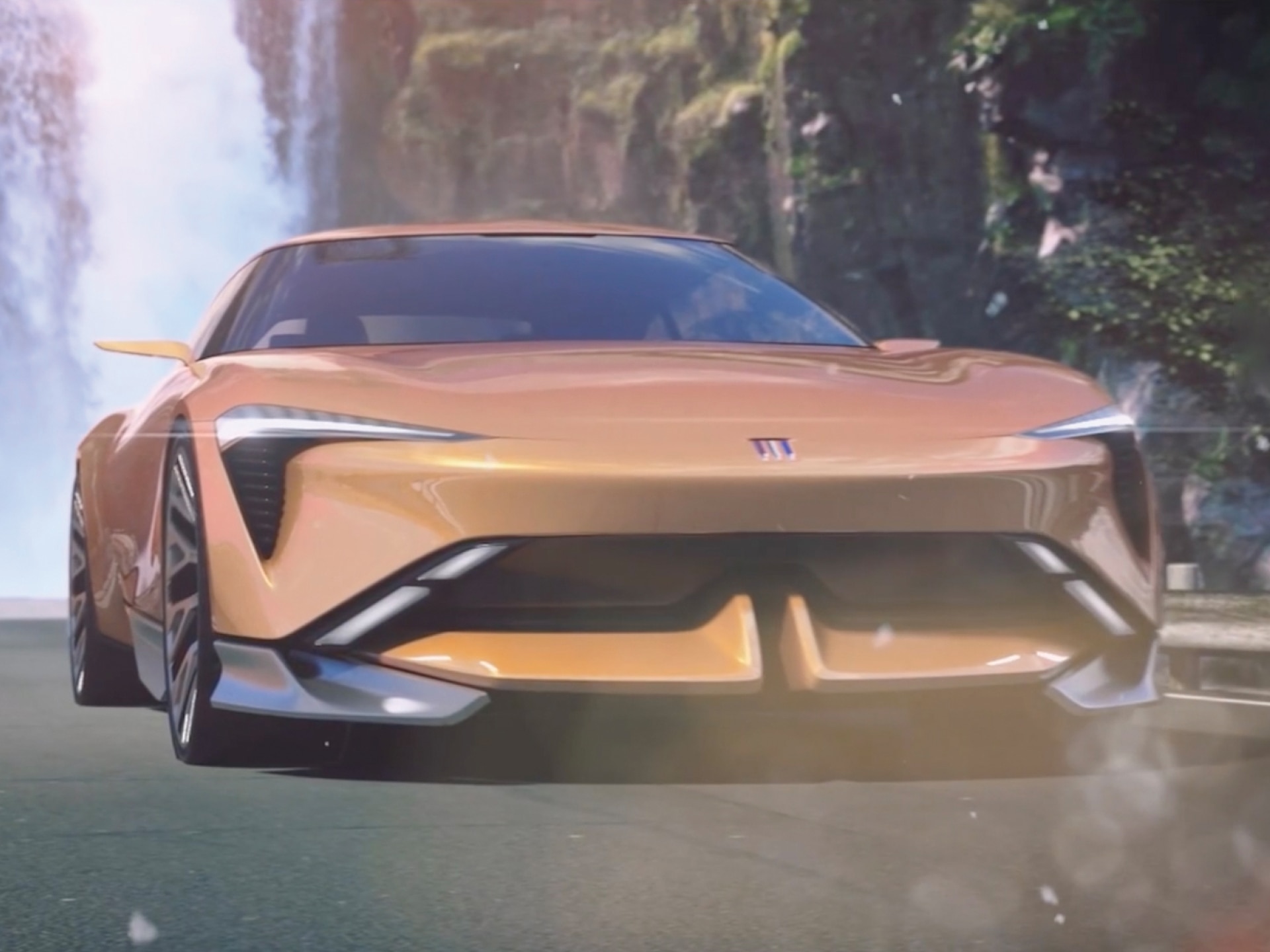 Close-up Front View of a Futuristic Buick Vehicle Driving Down a Road with a Waterfall in the Background