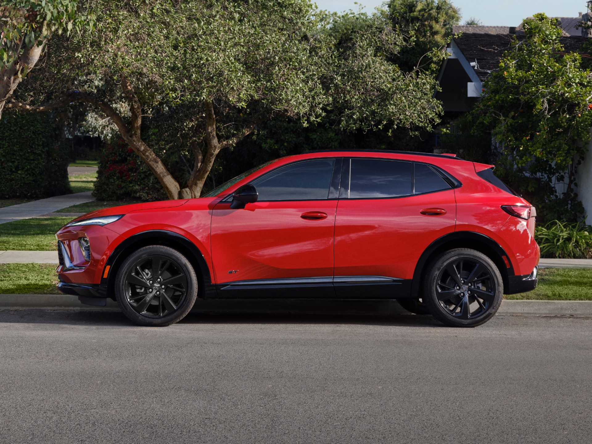 Profile View of a Red Buick SUV Parked on a Street