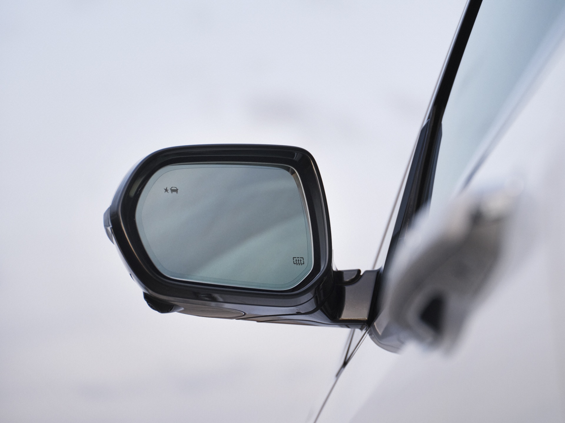 Close-up of the Drivers Side Side-View Mirror on a Buick Vehicle