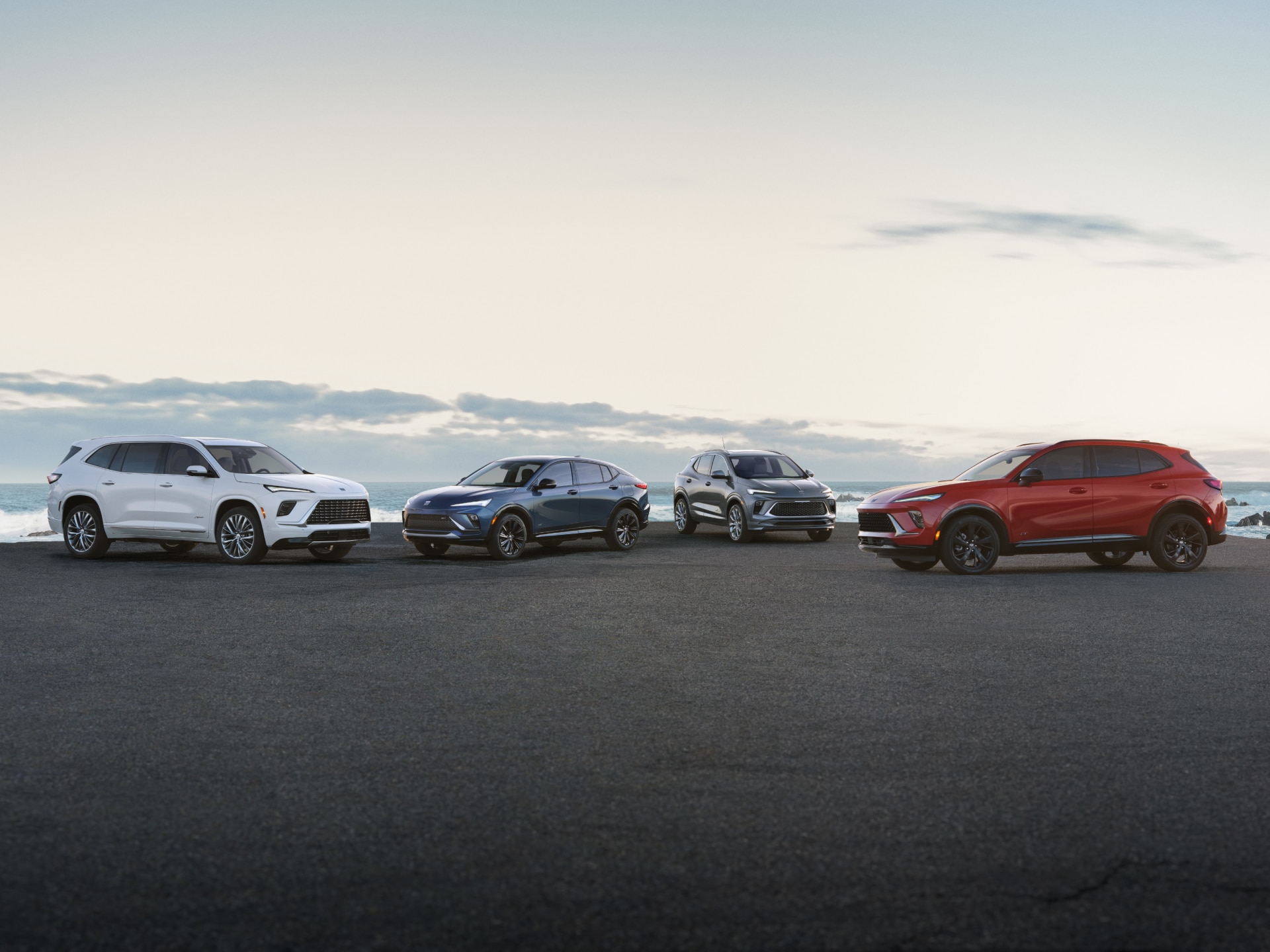 The Buick Lineup Parked Near a Body of Water on a Sunny Day