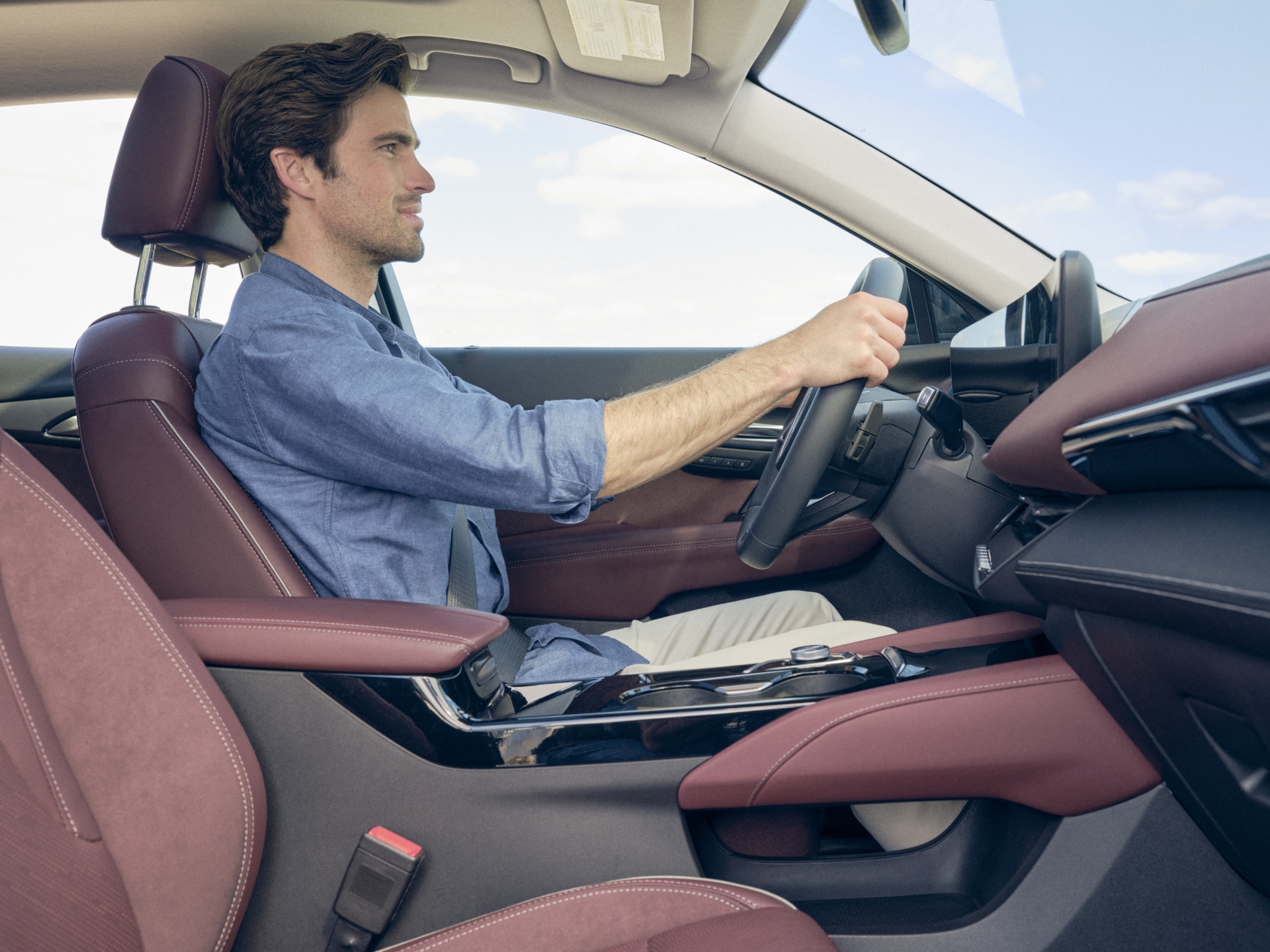 Side Profile View of a Man Driving in his Buick