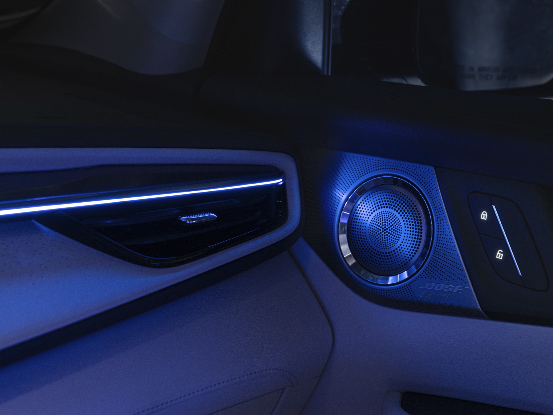 Close-up of the Bose Speaker in a Buick Vehicle with a Blue Hue