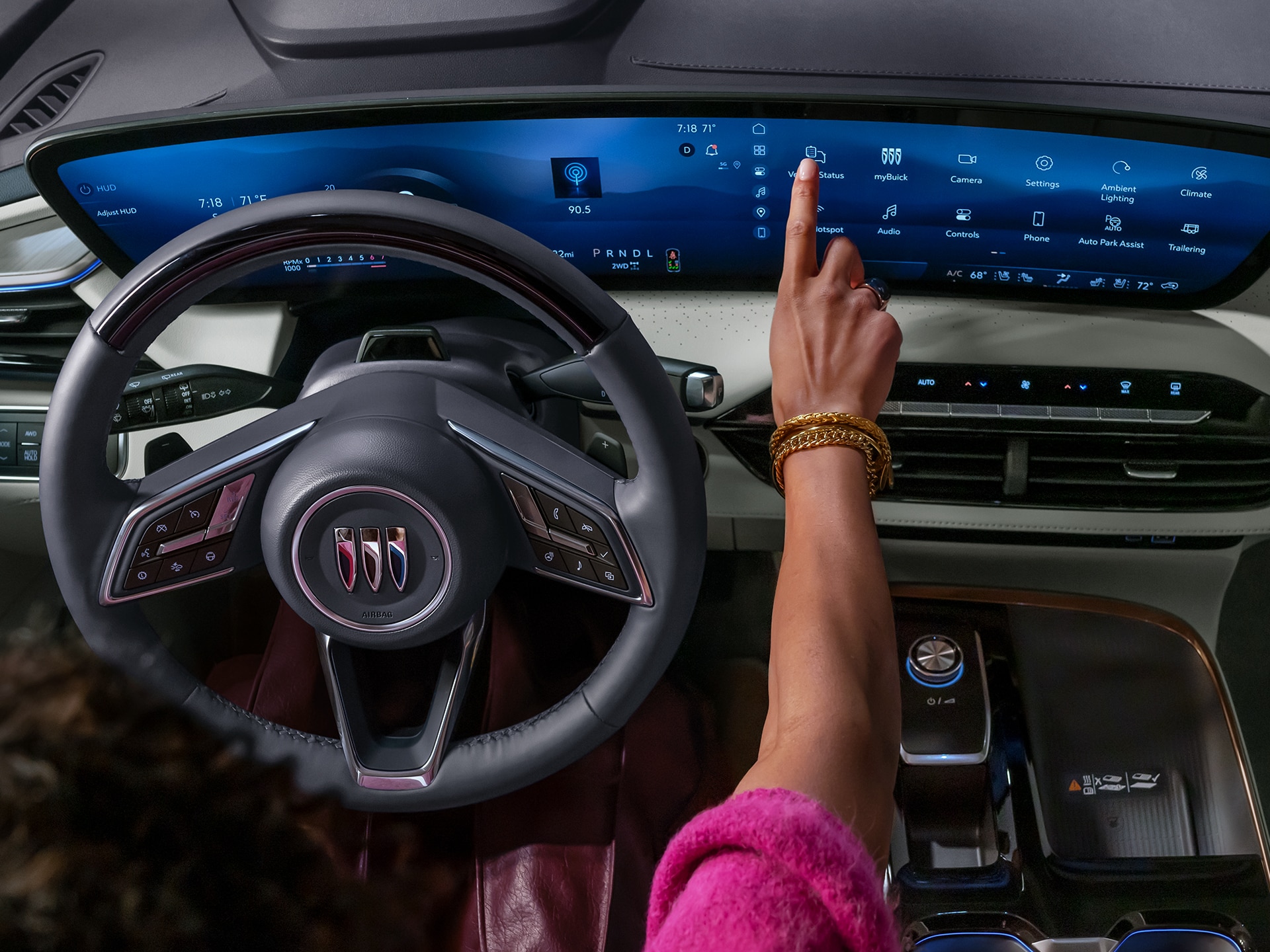 Women using the infotainment screen on a 2024 Buick Envision