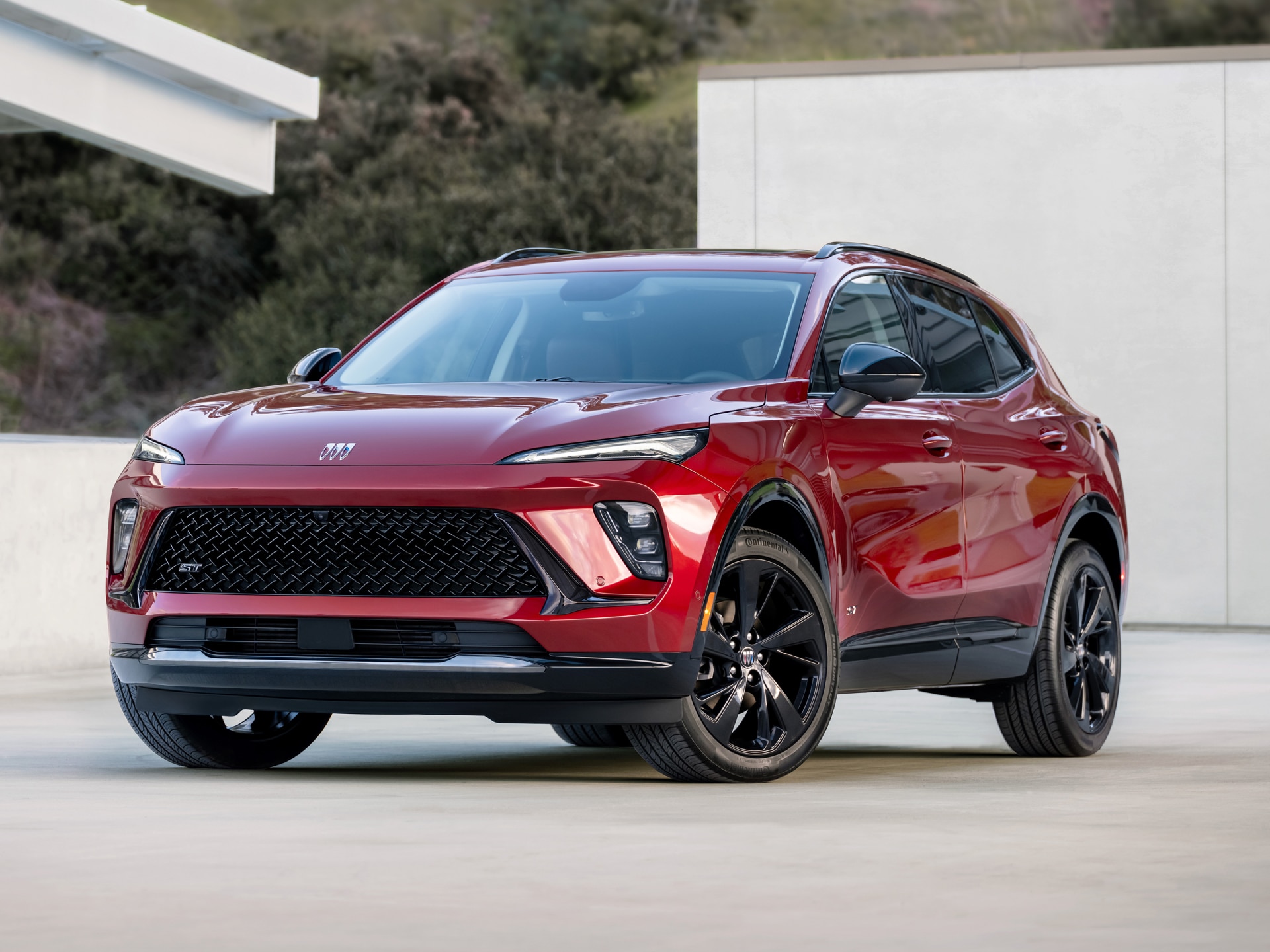 Front View of a Red Buick Compact SUV with a Distinctive Grille and Modern Headlights