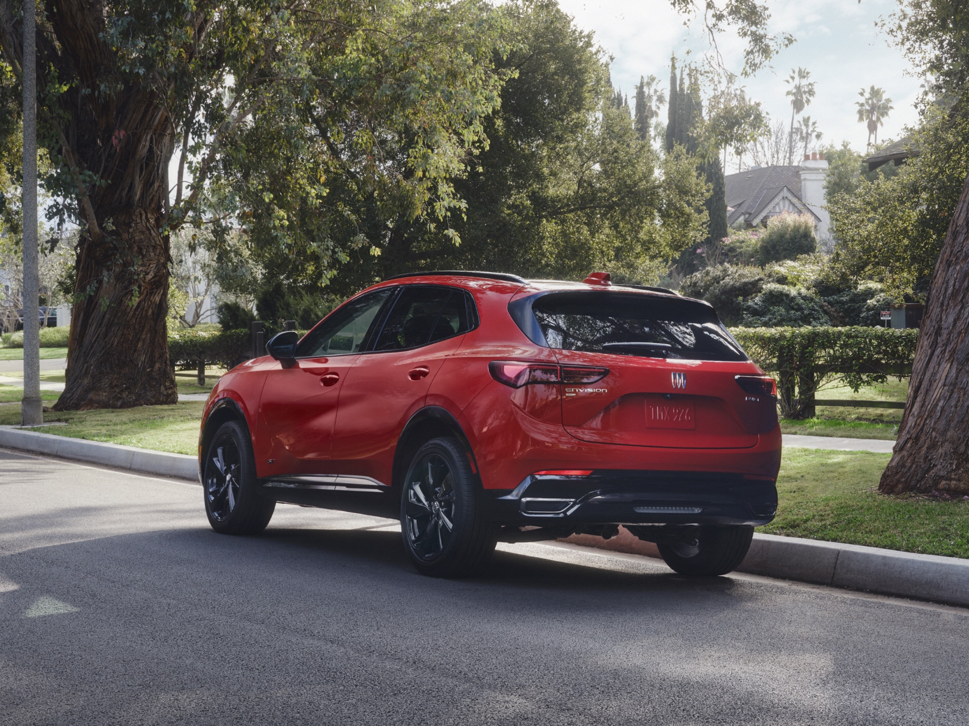 Rear & Side View of a Red Buick Enclave Parked on a Side Street