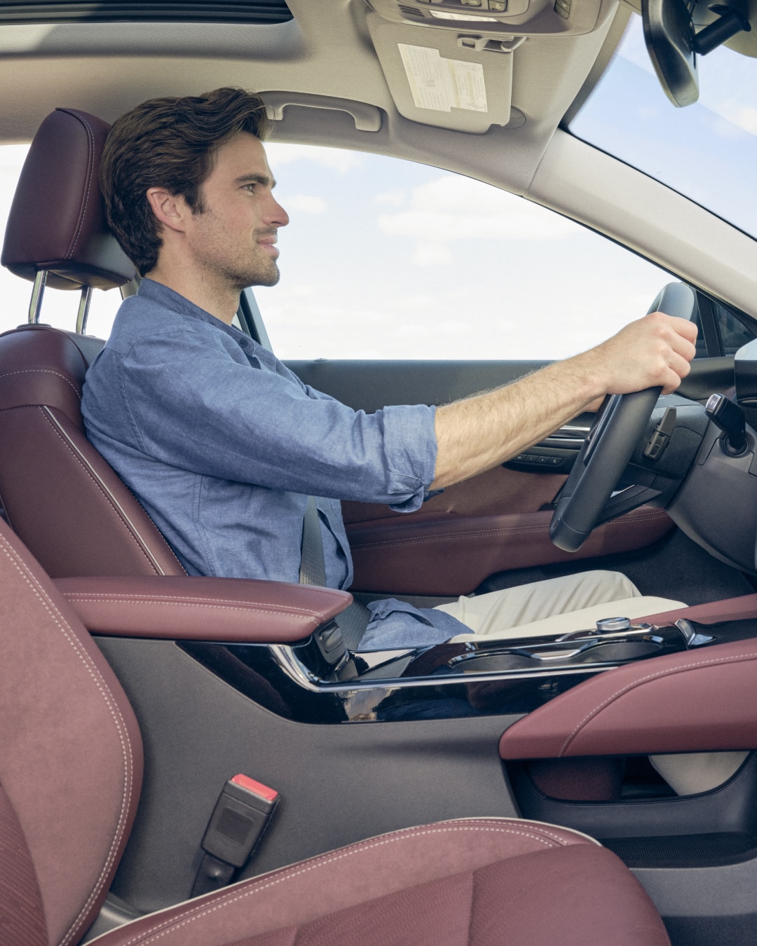 Side Profile View of a Man Driving in his Buick