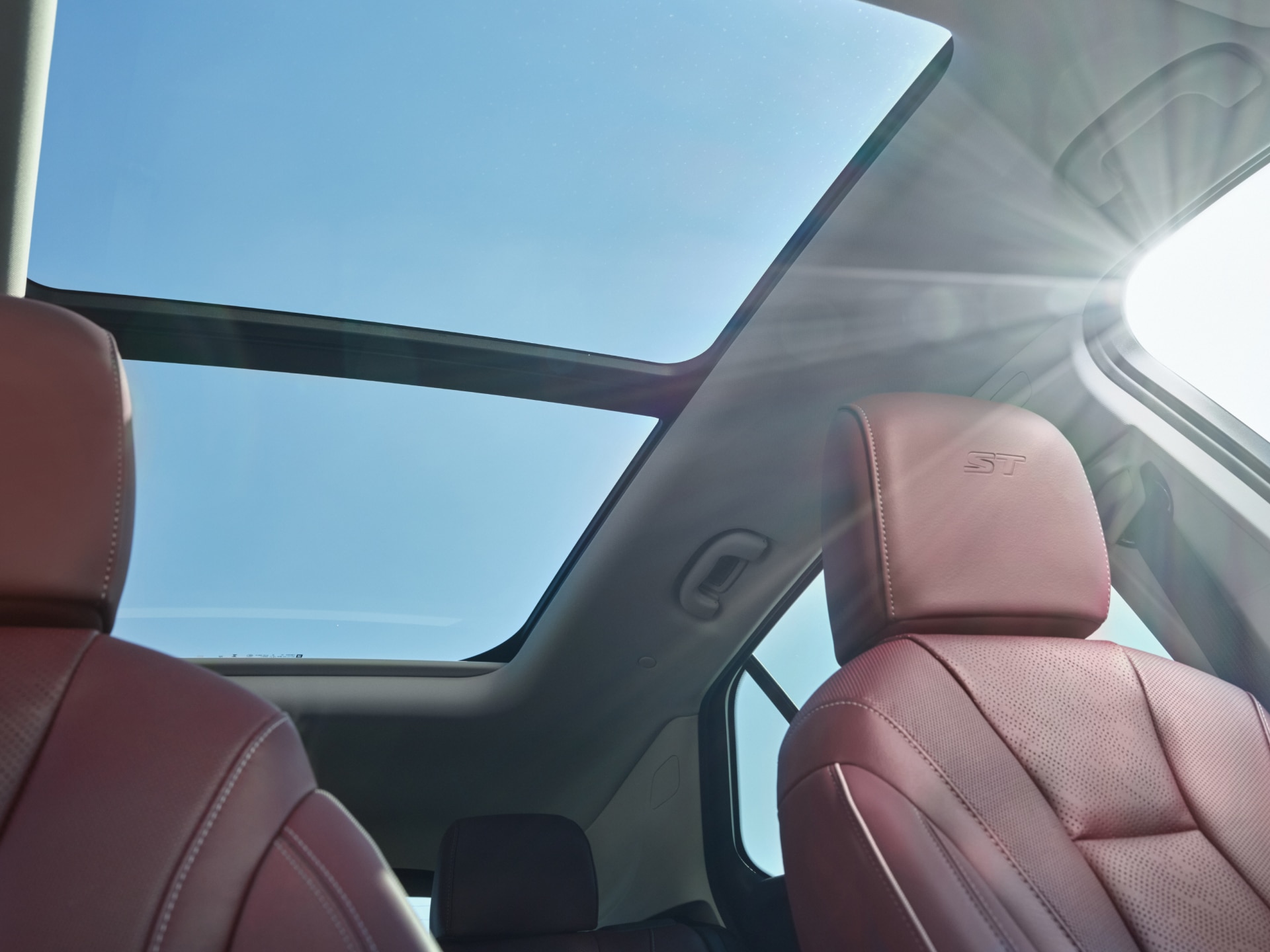 Interior View of the Panoramic Moonroof in the Buick Envision as the Sunlight Pours into the Vehicle