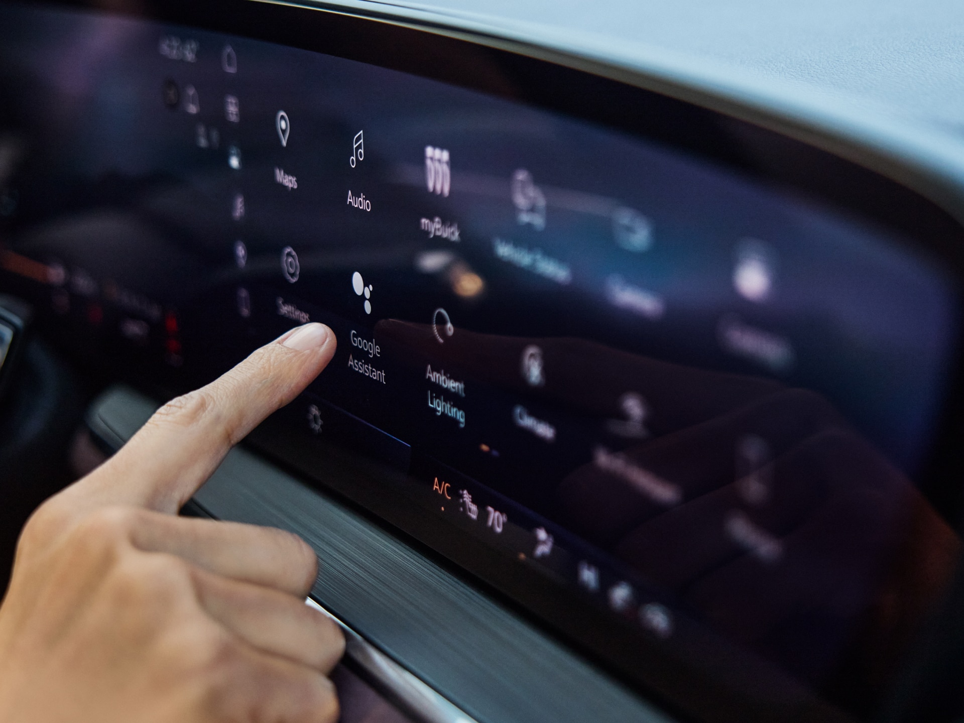 Close-up of the Driver in an Envision Using the Buick Infotainment Screen