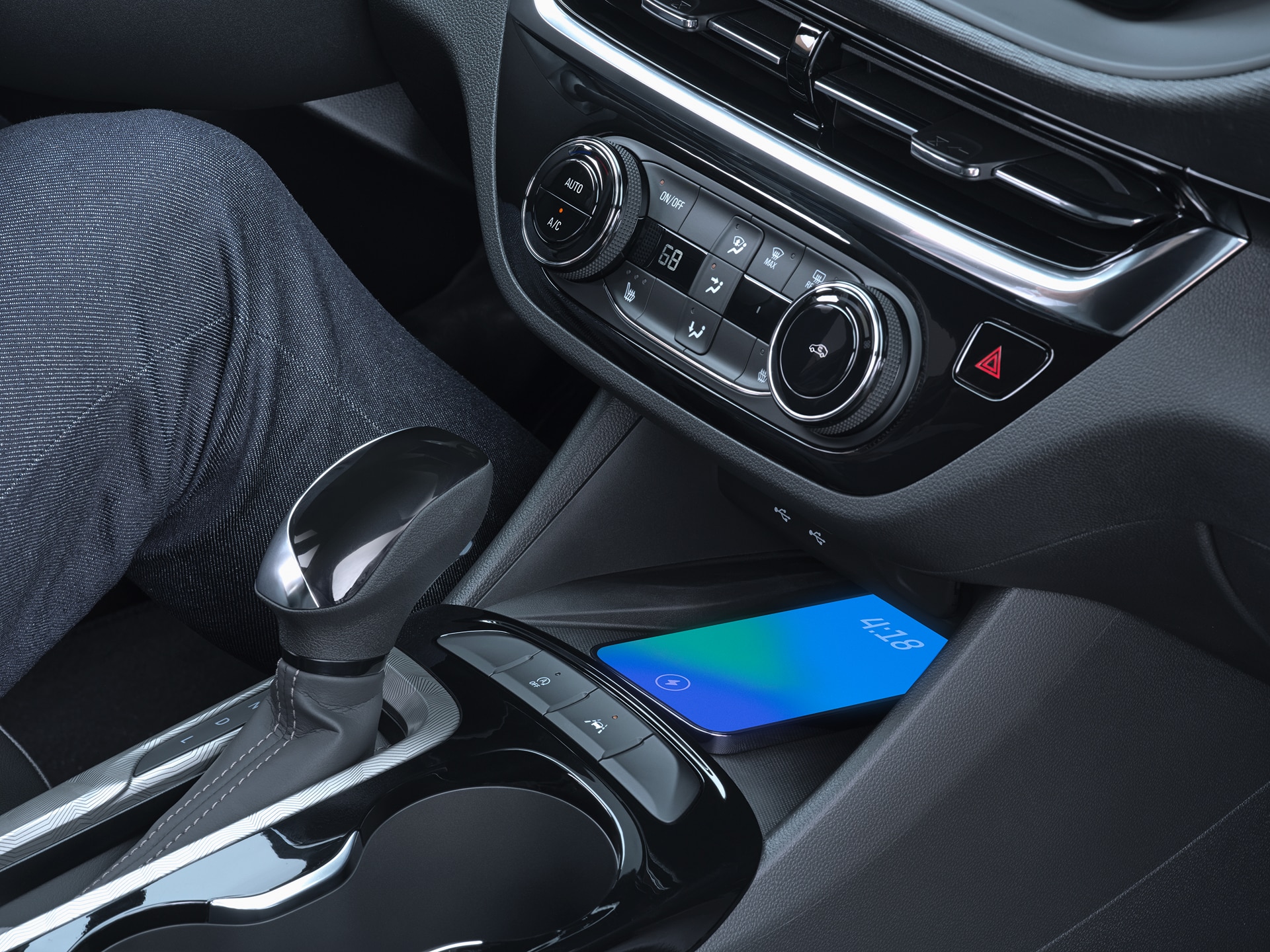 Close-up of a Smartphone Charging on the Wireless Charger in the Buick Envista