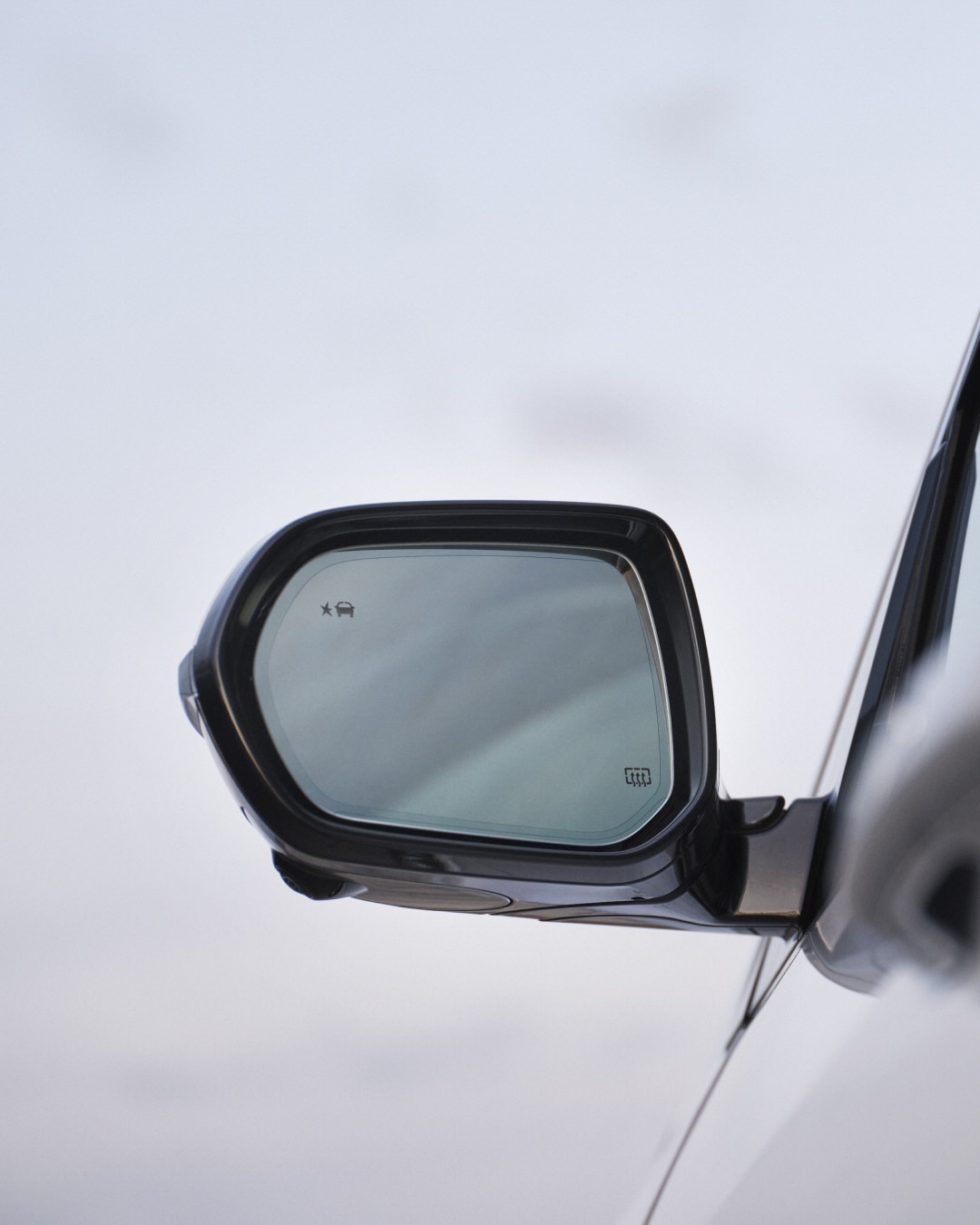 Close-up of the Drivers Side Side-View Mirror on a Buick Vehicle
