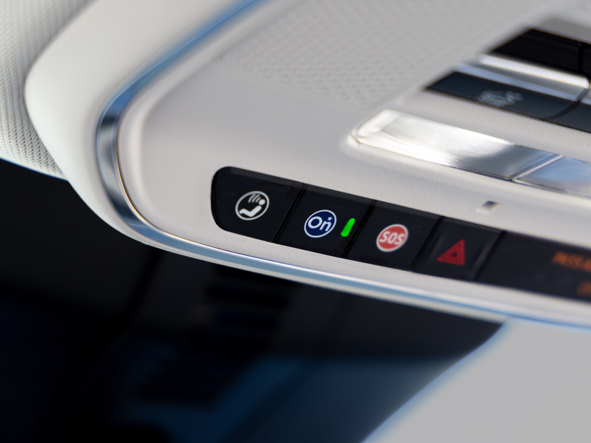 Close-up of the Blue OnStar Button in a Buick Vehicle