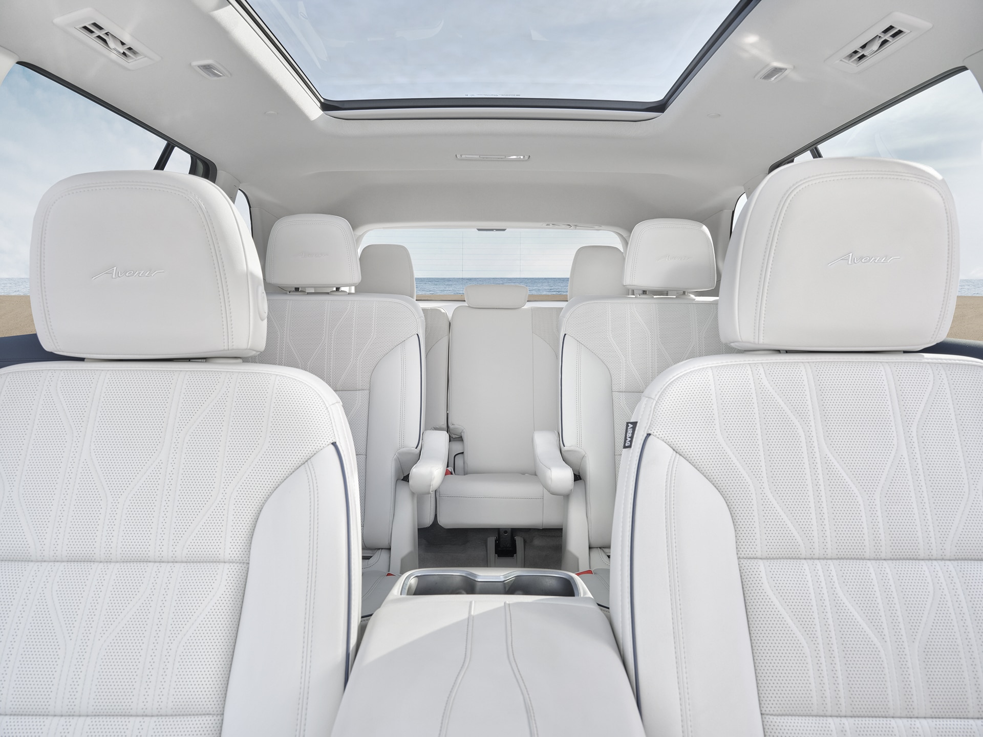 View of the White Interior Three-Row Seating in a Buick Vehicle