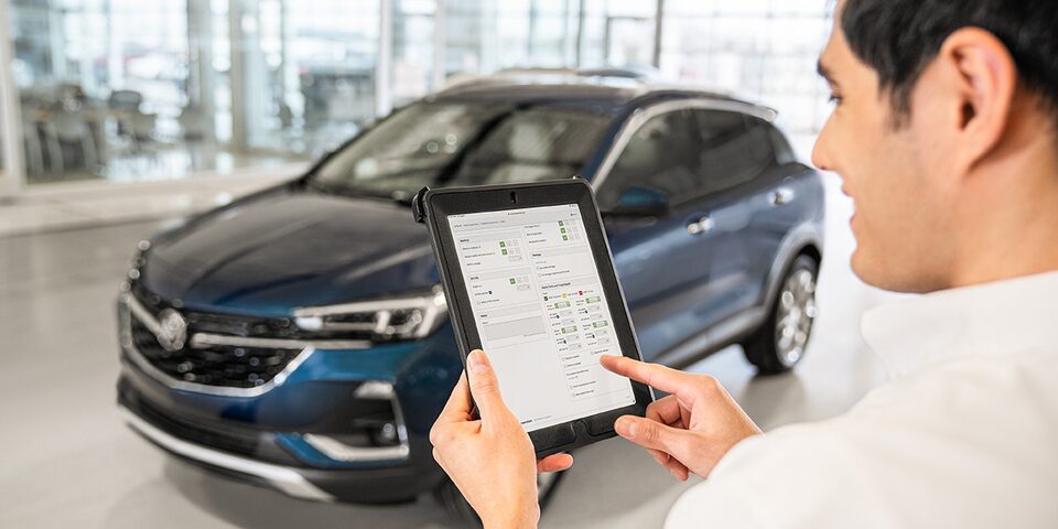 A Buick Certified Service Representative Using an iPad