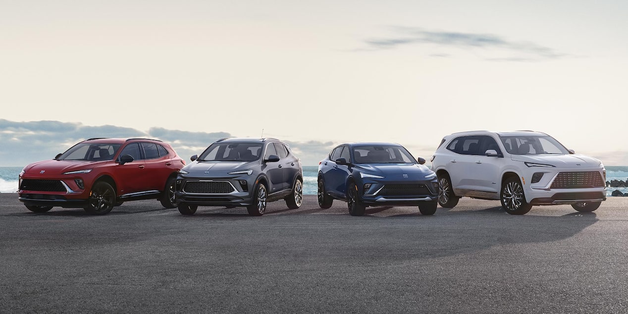 The Buick Lineup Parked Near a Body of Water on a Sunny Day