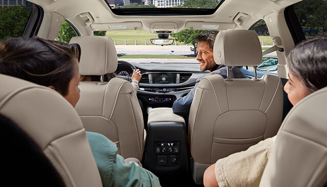 Rear Interior View of Passengers Sitting in the 2022 Buick Enclave