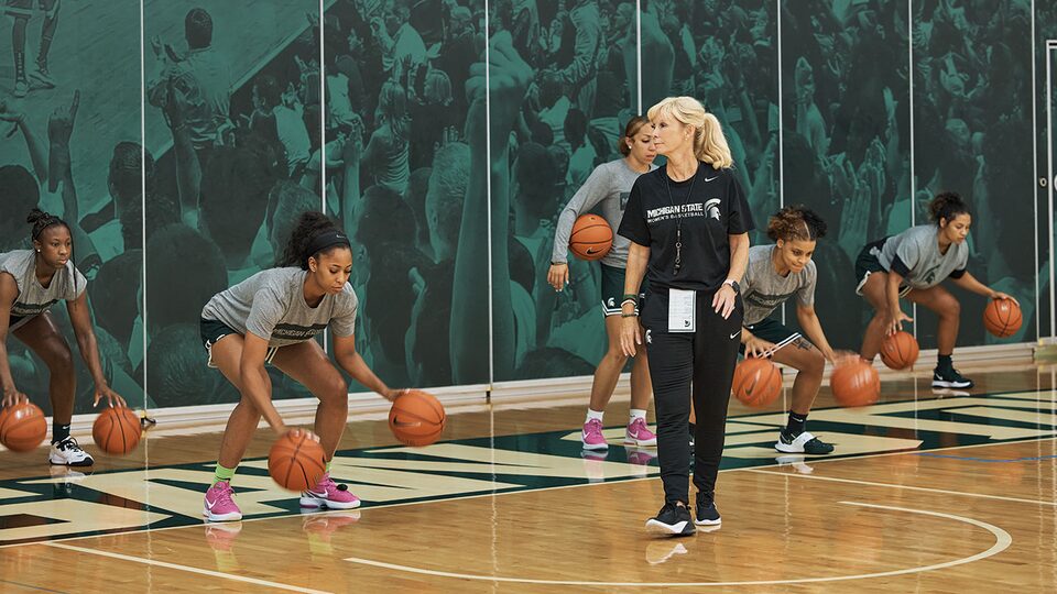 Suzy Merchant Watching Players do Drills at Practice
