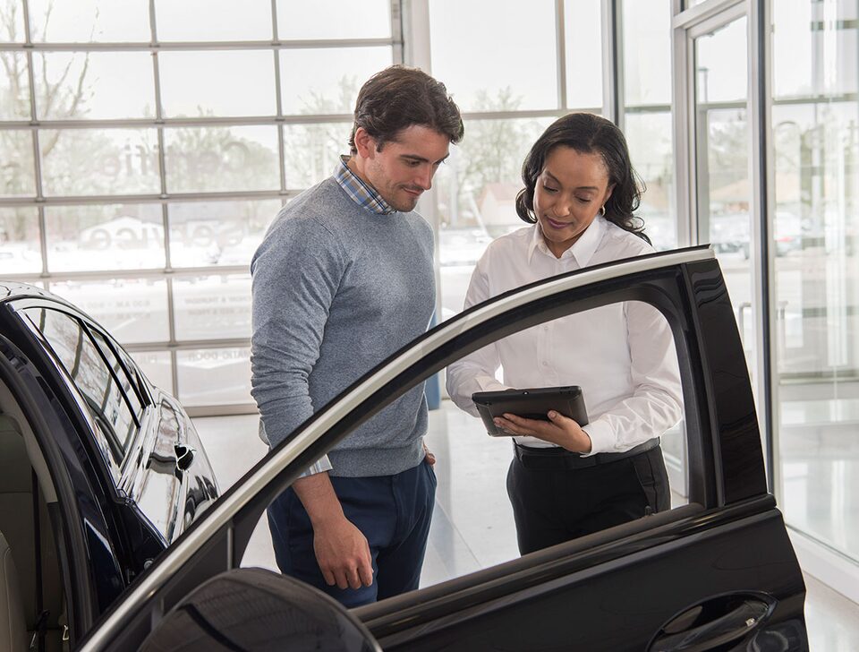 Buick service professional talking to customer about his vehicle