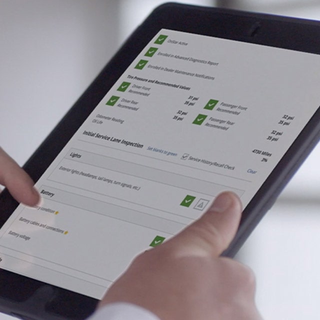 Buick Certified Service Expert Providing an Estimate on a Tablet