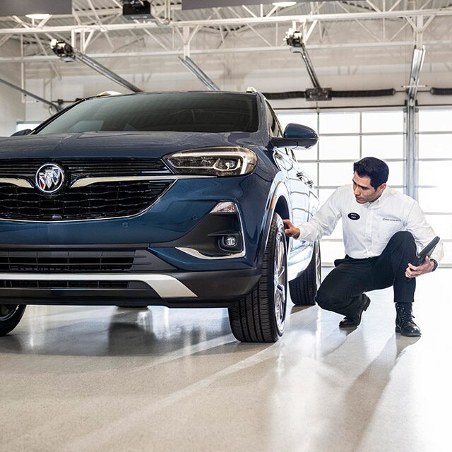 Buick Certified Service Technician Replacing Vehicle’s Tire