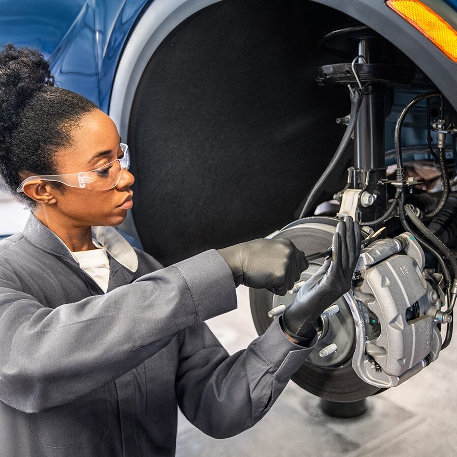 Buick Technician Working on a Vehicle's Brake System