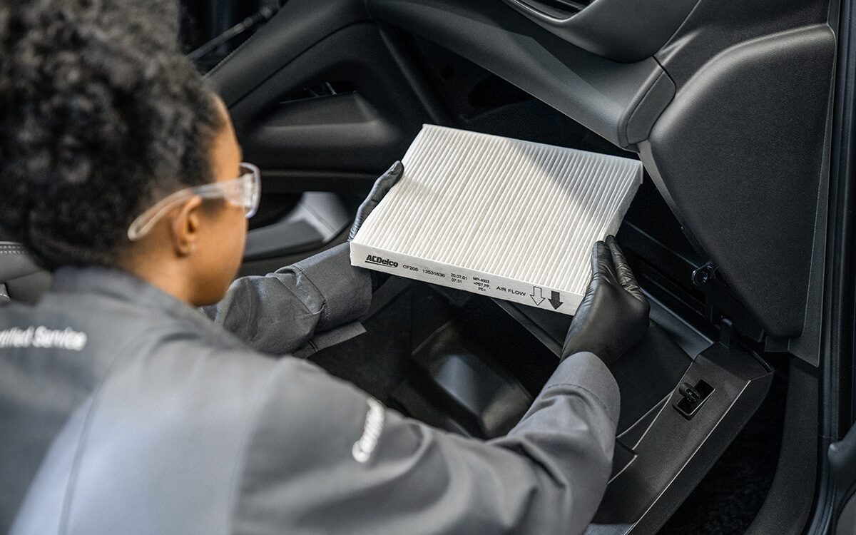 A Buick Certified Service Technician Installing a Cabin Air Filter