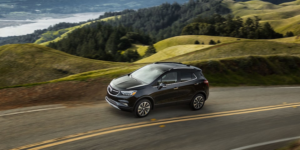 Buick Encore SUV driving through the countryside