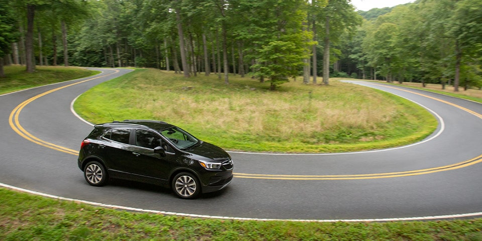 Buick Encore SUV driving through the countryside