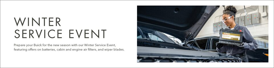 A Buick Certified Service Technician Installing an ACDelco Gold Battery in a GM Vehicle With Text Overlay "Winter Service Event" and "Prepare your Buick for the new season with our Winter Service Event, featuring offers on batteries, cabin and engine air filters, wiper blades, and more."