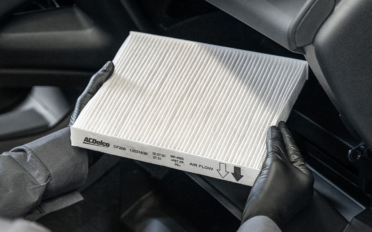 Changing a White Colored Air Filter from inside a Chevrolet Vehicle