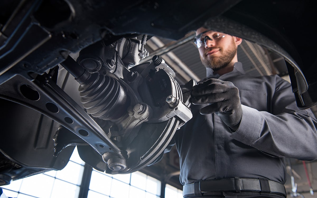 A Buick Certified Service Technician Installing an Engine Air Filter