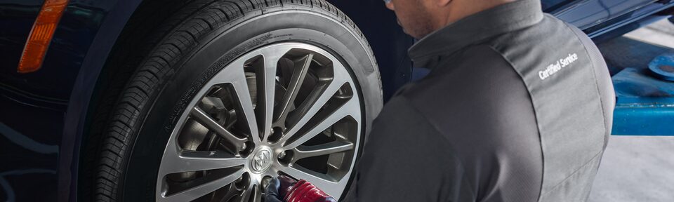Buick Certified Service Technician Changing A Vehicle’s Tire