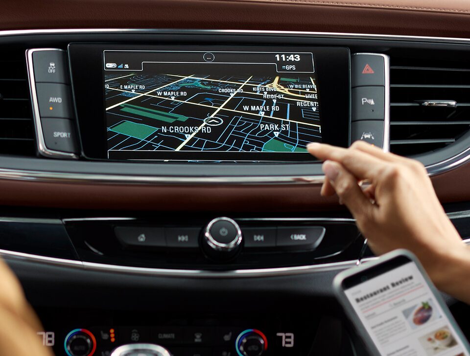Closeup image of the color touch display in a Buick vehicle using the smart radio features.
