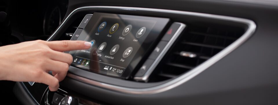 Person Utilizing the OnStar Services App on the Buick Infotainment System