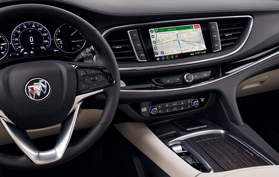 The Stylish Interior of a Buick with the Steering Wheel, Infotainment System Displaying GPC, and Heads-Up Display
