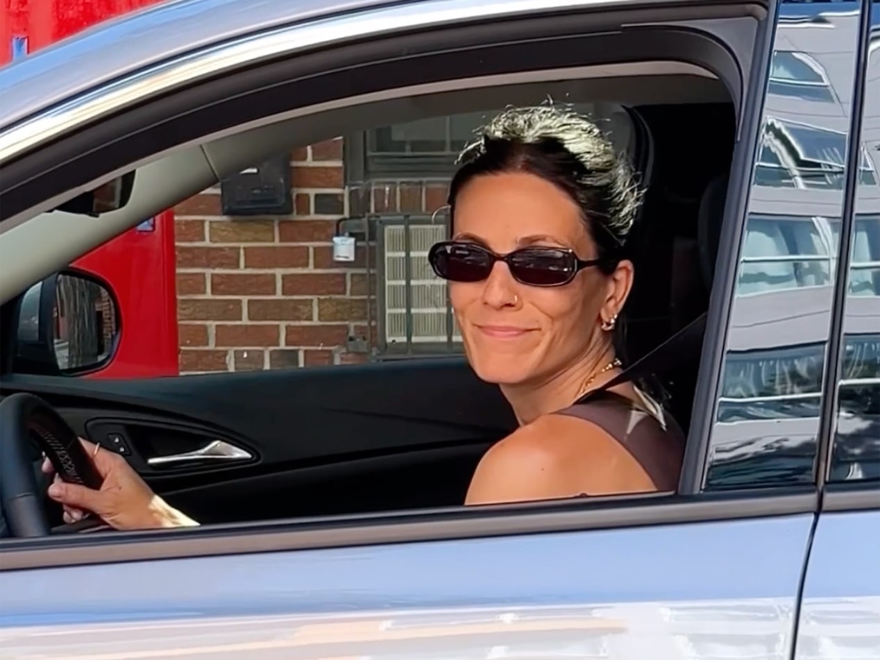 Influencer Eden Grinshpan Smiling From the Driver's Seat of a Silver 2025 Buick Encore GX Avenir