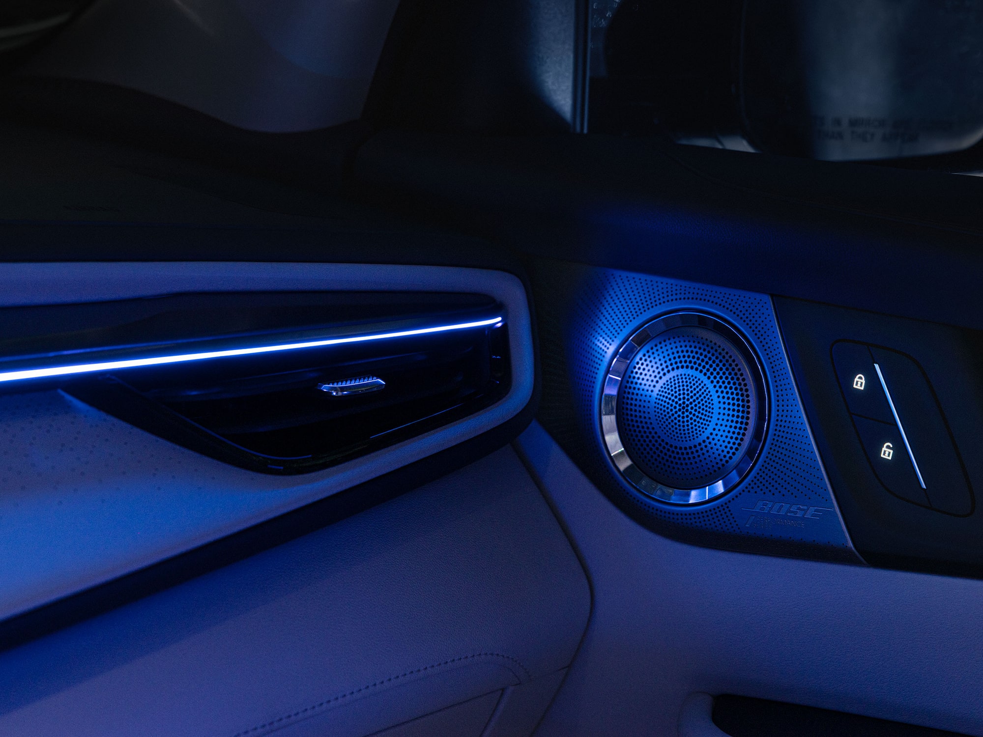 Close-up of the Bose Speaker in a Buick Vehicle with a Blue Hue